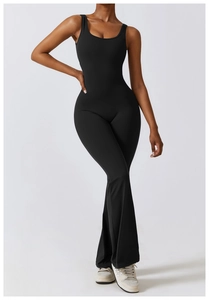 Detail view of black high-waist yoga jumpsuit featuring wide-leg cut and stretchy fabric
