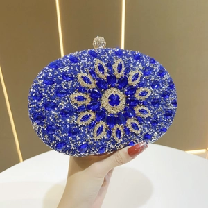 Detail of blue sunflower evening clutch with luxury rhinestones and crystal flower pattern