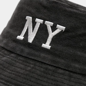 Close-up of premium washed cotton bucket hat featuring white 3D NY embroidery detail