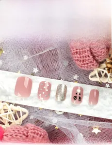 Christmas press-on nails set with glitter, deer patterns and nude pink finish details