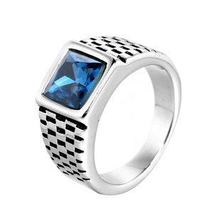 Vintage stainless steel ring with blue sapphire stone and checkerboard pattern on the side