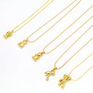 Set of five gold-tone necklaces with cute bear and cat pendants and sparkling crystals