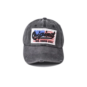 Detailed shot of vintage washed cotton baseball cap with American flag embroidery