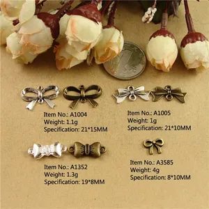 Zinc alloy bow pendants in antique silver and bronze for DIY jewelry crafting