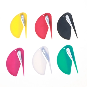 Colorful bird-shaped letter openers and elastic hair tie cutters set in vibrant colors