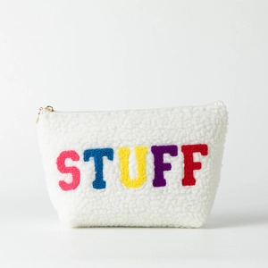 Detailed view of white plush cosmetic bag with colorful STUFF bouclé embroidery