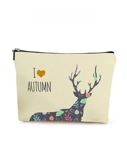 Detail of canvas toiletry bag with elk silhouette print and autumn themed letters