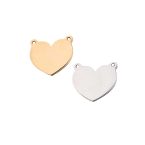 Polished heart shaped stainless steel pendants in gold and silver finish on white background