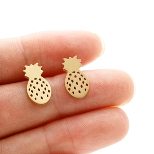 Handheld view of golden pineapple stud earrings with hollow dot design in stainless steel