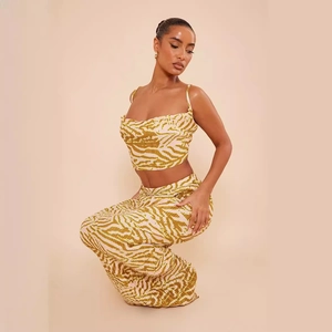 Women's two-piece pleated set with crop top and trousers in zebra print pattern