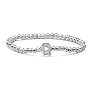 Macro view of silver beaded elastic bracelet with a micro-pave zircon letter Q charm