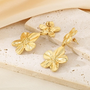 Elegant 18K gold-plated stainless steel flower petal drop earrings on satin backdrop