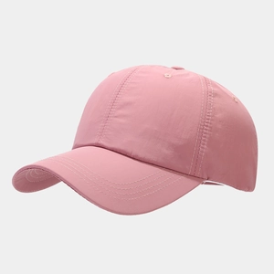 Detail of pink waterproof baseball cap showing premium white stitching and quick-dry fabric