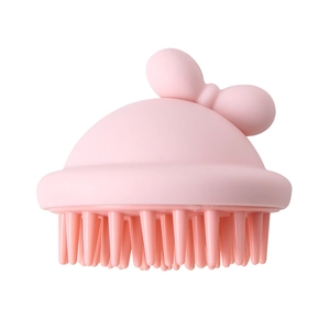 Pink silicone scalp massager brush with cute bow design for hair washing and cleaning