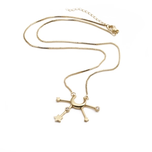 Elegant gold celestial necklace featuring crescent moon and star pendants with zirconia