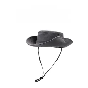 Detail view of grey outdoor sun hat featuring adjustable chin strap and wide brim for fishing
