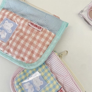 Detail of quilted cotton coin purses with clear PVC pockets and cute bear card inserts