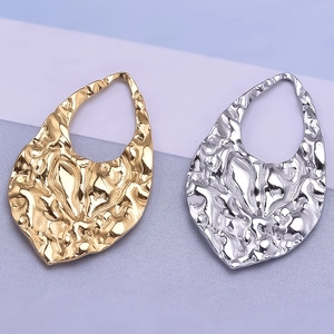 Detail of 304 stainless steel hammered teardrop pendants in gold and silver finishes