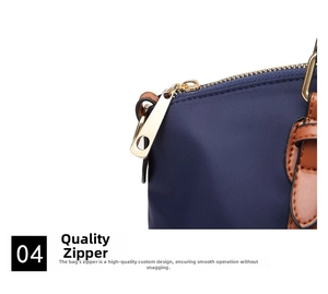 Close-up of deep blue oxford fabric tote with leather trim and gold metal zipper detail