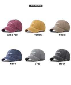 Multiple colors of washed cotton baseball caps with No Joke embroidery displayed in a grid