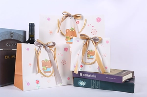 Three sizes of cartoon bear gift bags with elegant gold ribbons and Happy Times print