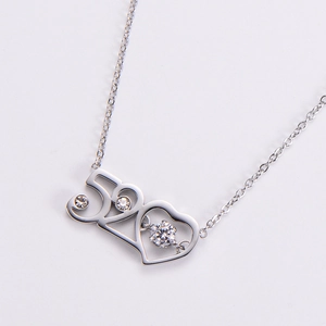 Macro view of silver 520 heart pendant necklace featuring sparkling zircon stone settings