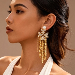 18K gold plated long tassel earrings with faux pearls and leaf charms on female model