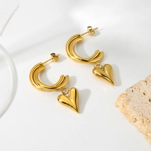 14k gold plated stainless steel double C-shaped heart earrings on a natural stone base