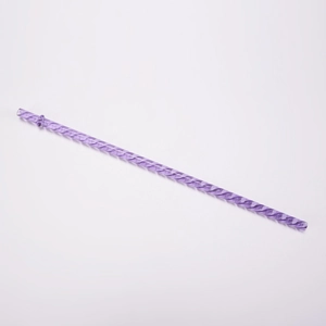 Close-up of a purple Tritan reusable straw with a unique twisted spiral design texture