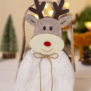 Detail of felt Christmas reindeer gift bag with plush texture and festive decor
