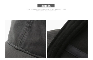 Detail view of reinforced stitching and curved brim on a gray cotton twill baseball cap