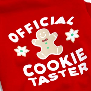 Detail of red dog T-shirt with Official Cookie Taster print and gingerbread man motif