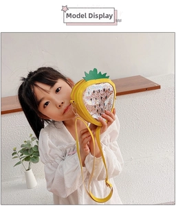 Detail of yellow strawberry jelly bag with sparkling sequins and stars for kids