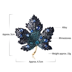 Exquisite crystal maple leaf brooch with blue rhinestones measuring 5cm by 4.7cm