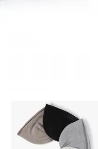 Detail of knitted beanie textures in black, khaki, and grey highlighting warm thermal fabric