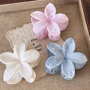 Three gradient floral hair claws in pink, blue and white with marble texture finish