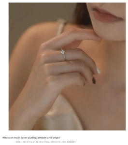 Macro view of a 925 silver flower ring with zircon stones and a twisted rope band detail