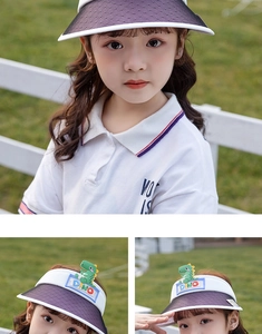 Detail of kids sun visor featuring green dinosaur decor and breathable mesh brim