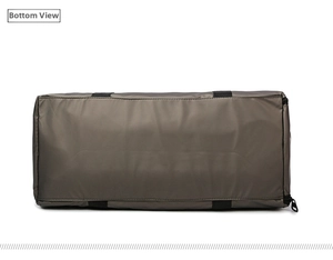 Close-up of the reinforced bottom of the brown waterproof travel bag with strong stitching