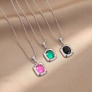 Three elegant stainless steel ball chain necklaces with pink green and black oval crystals