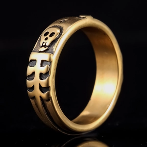Vintage punk skull ring in gold and black stainless steel with gothic rib relief