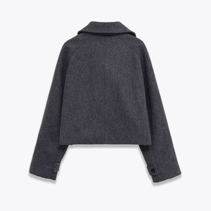 Back view of stylish dark gray cropped wool trench coat with chic lapels for women