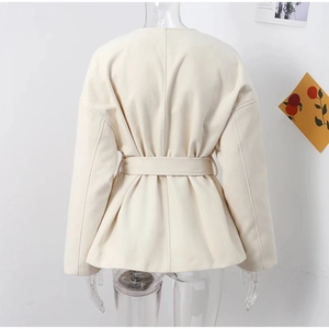 Back view of cream short jacket with long sleeves and matching waist belt tie