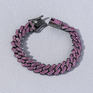 Hip hop black Cuban link bracelet with sparkling pink rhinestones on textured background