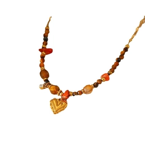 Bohemian natural stone beaded necklace with a golden heart pendant for women
