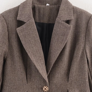Women's brown herringbone tweed blazer with notch lapels and single-breasted detail