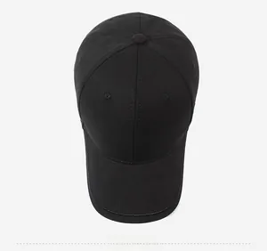 Overhead view of a classic black cotton baseball cap with six-panel construction and stitching