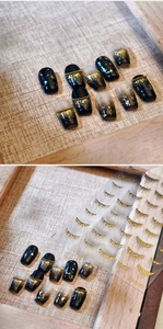 Macro detail of M-971 golden liquid tassel nail art stickers on textured linen background