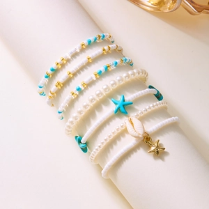 Bohemian gold starfish and shell beaded anklet set with white pearls and blue charms