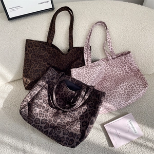Detailed comparison of leopard print tote bags in dark brown, grey, and pink finishes